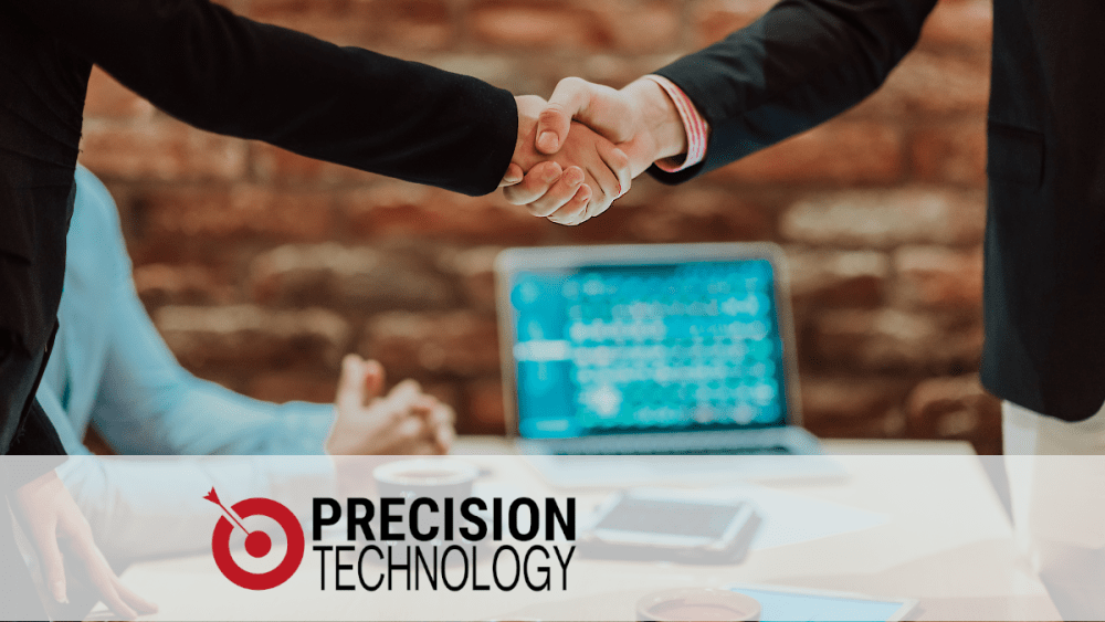 Technology HR professional and Tech Staffing representative close deal with handshake.